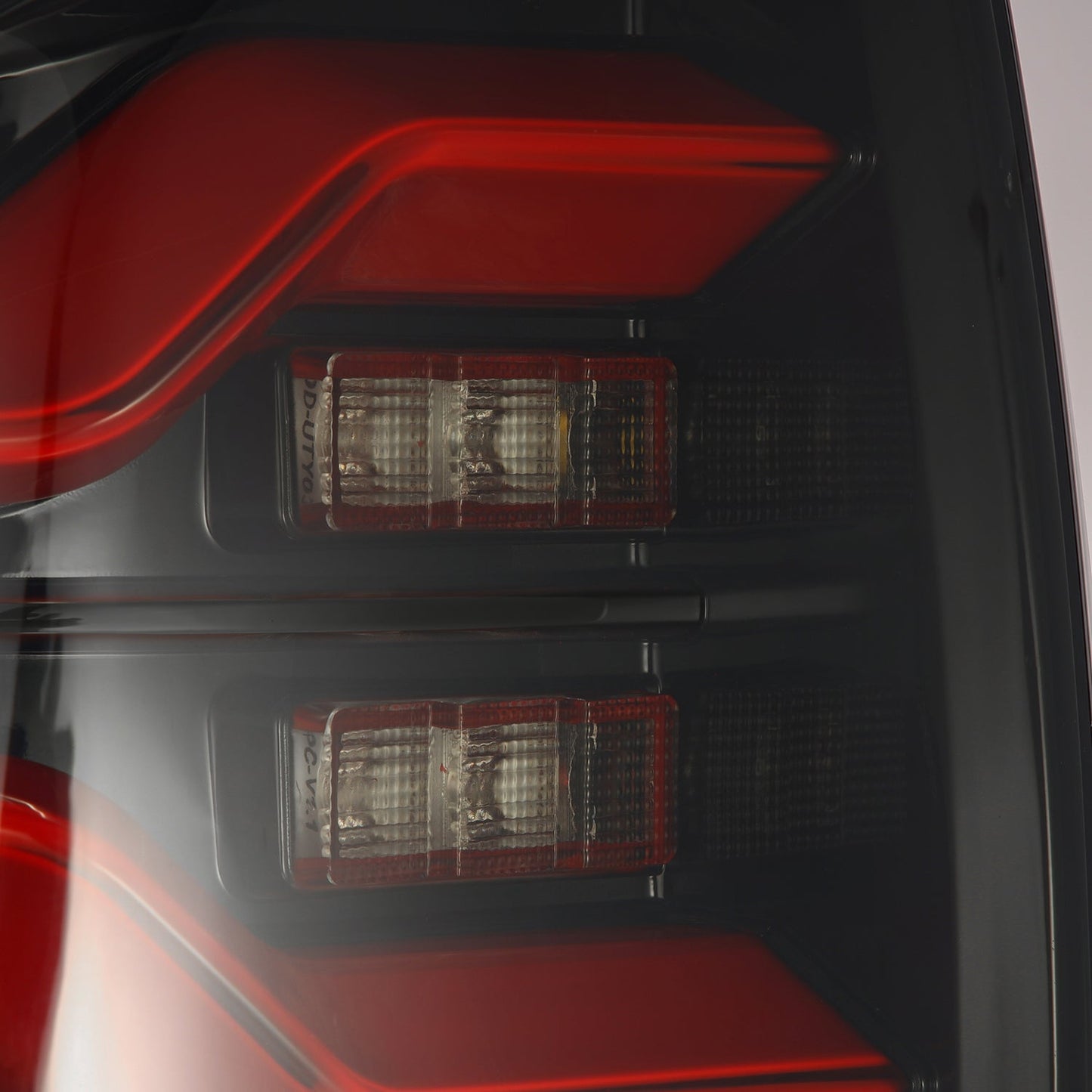 AlphaRex 16-23 Toyota Tacoma LUXX-Series LED Tail Lights Black-Red