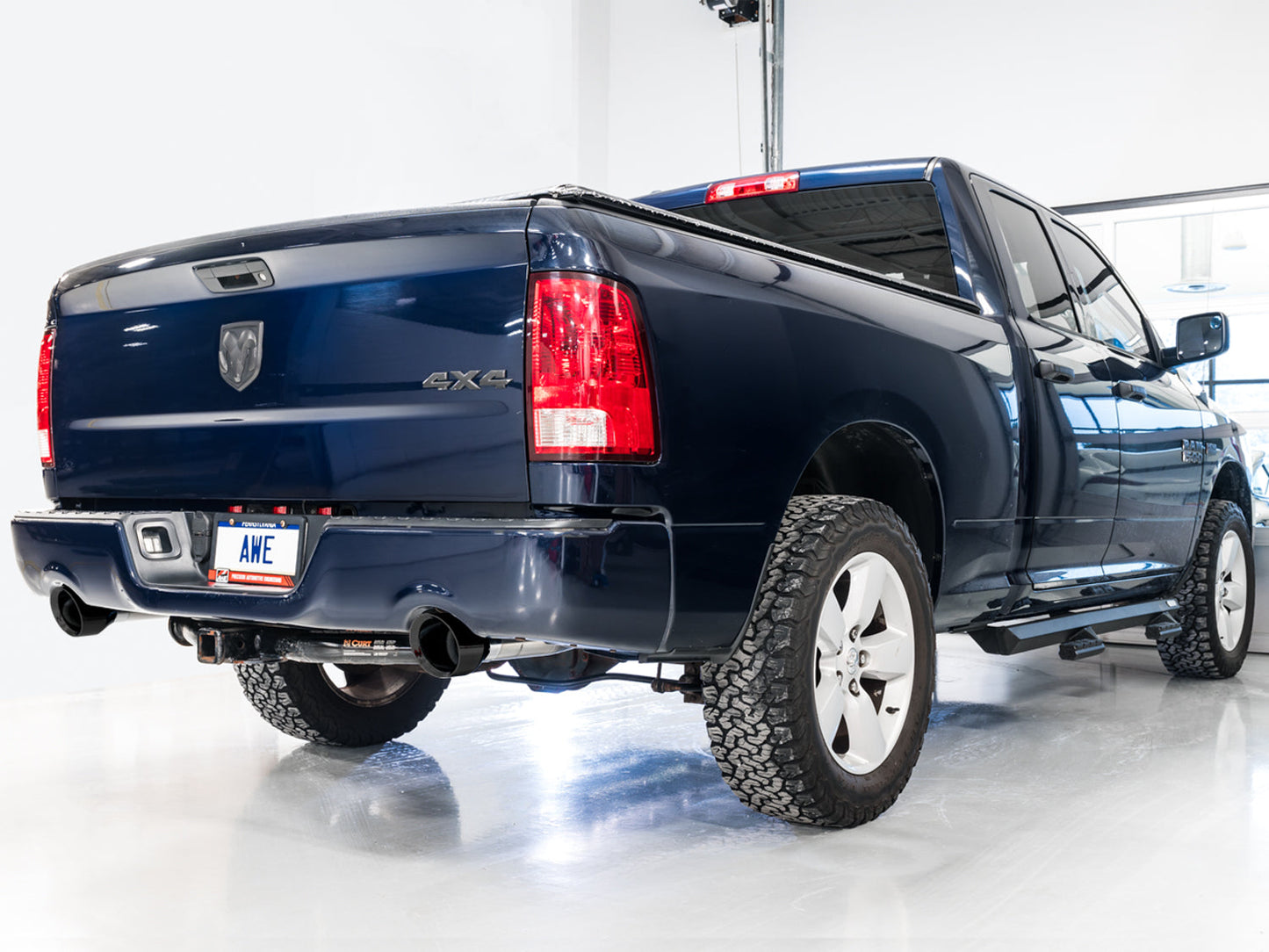 AWE Tuning 0FG Dual Rear Exit Catback Exhaust for 4th Gen RAM 1500 5.7L (with bumper cutouts) - Diamond Black Tips (3015-33004)