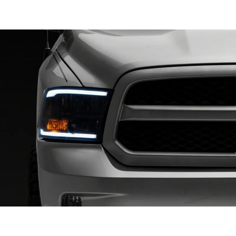 Raxiom 09-18 Dodge RAM Axial Headlights w/ LED Bar | 2009-2018 (R131481)
