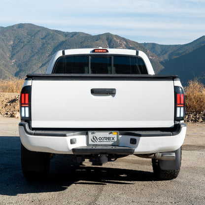 AlphaRex 05-15 Toyota Tacoma NOVA-Series Prismatic LED Tail Lights Black