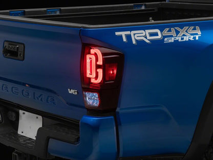 Raxiom 16-23 Toyota Tacoma XW Seq LED Tail Lights Black Housing Red Lens (TT30332)