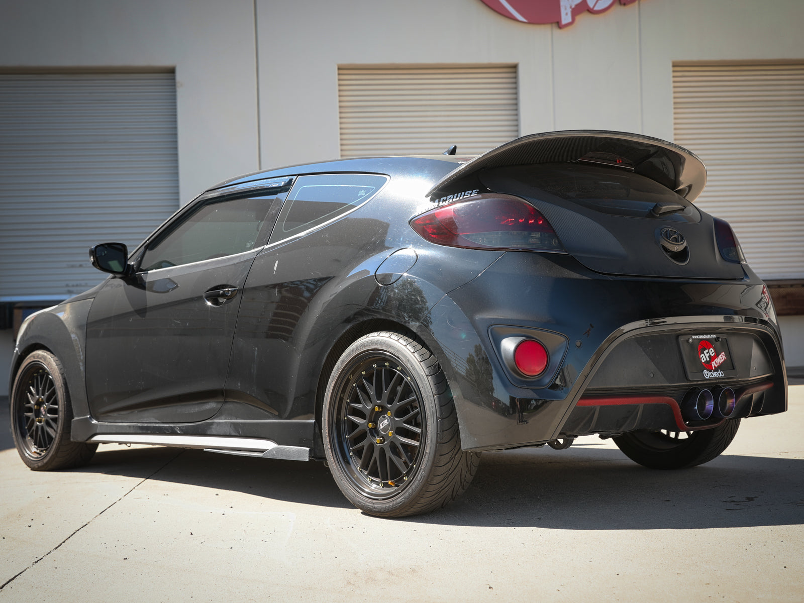 aFe Takeda 2-1/2in SS Axle-Back Exhaust w/ Blue Flame Tips | Veloster Turbo (13-17) (49-37019-L)