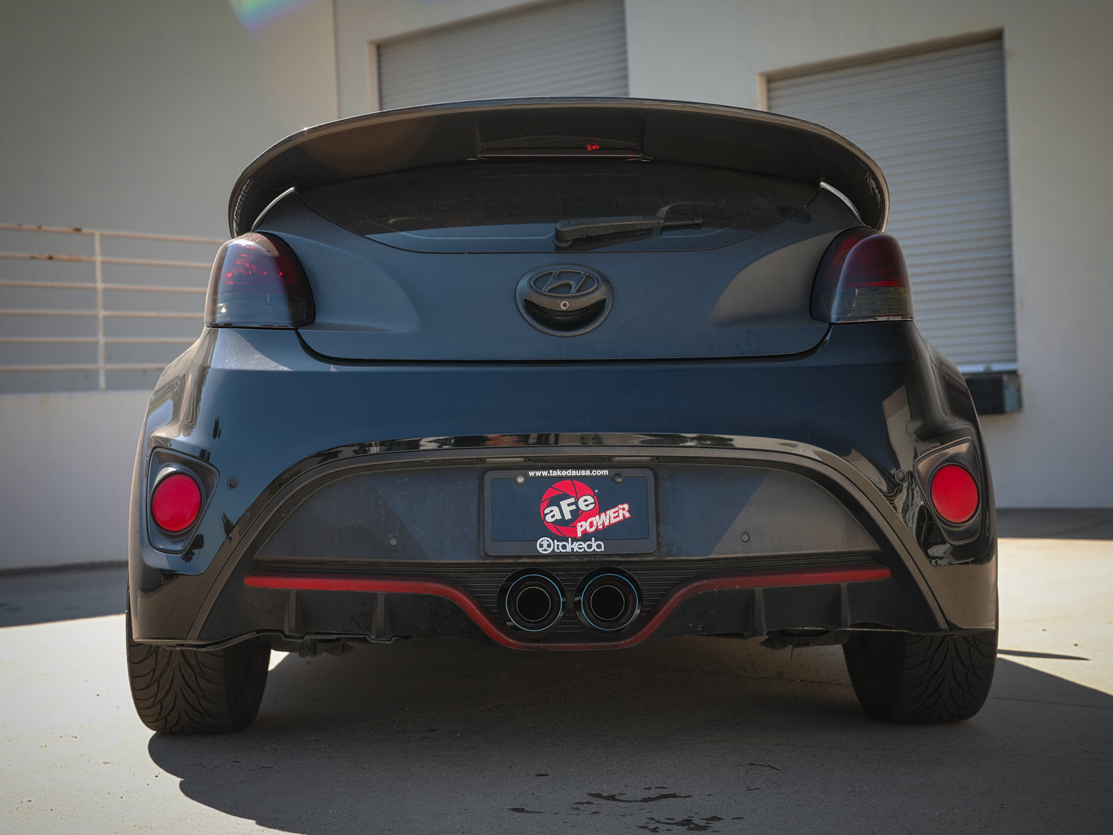 aFe Takeda 2-1/2in SS Axle-Back Exhaust w/ Blue Flame Tips | Veloster Turbo (13-17) (49-37019-L)