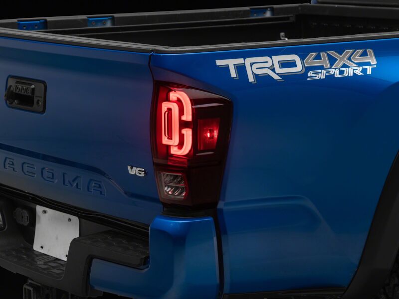 Raxiom 16-23 Toyota Tacoma XW Seq LED Tail Lights Black Housing Red Lens (TT30332)